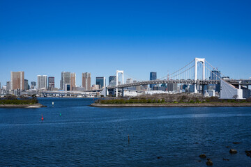 Tokyo seen from the artificial island of Odaiba in Tokyo Bay, linked by the Rainbow Bridge.