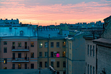 Vivid springtime sunset over Saint Petersburg, with dramatic clouds and warm hues reflecting off...
