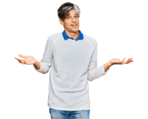 Young hispanic man wearing casual clothes clueless and confused expression with arms and hands raised. doubt concept.