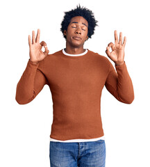 Handsome african american man with afro hair wearing casual clothes relax and smiling with eyes closed doing meditation gesture with fingers. yoga concept.