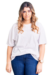 Obraz premium Young caucasian woman wearing casual clothes looking sleepy and tired, exhausted for fatigue and hangover, lazy eyes in the morning.