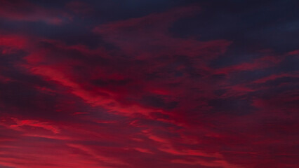 The sky is ablaze with fiery red and purple hues, creating a dramatic and stunning sunset canvas....