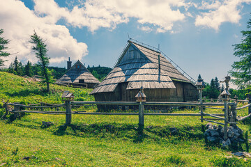 Traditional Mountain Wooden Shepherd Shelters on Big Pasture Plateau or Velika Planina in Slovenia - 780823260