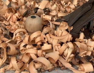 Close-up image of wood shavings after working with a plane.