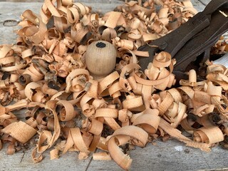 Close-up image of wood shavings after working with a plane.
