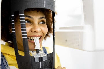 A girl with Arab features visits a dental clinic. A black woman with afro hair undergoes a...