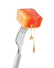 Slice of salmon with dripping drops of fat on a fork