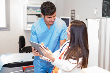Medics with tablet in office