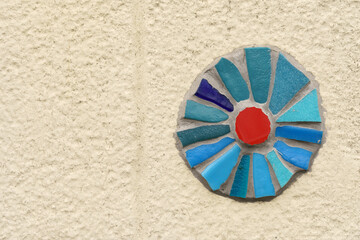 Blue and Red Glass Piece Adorning Building Facade