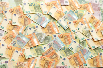 Fototapeta na wymiar Many european euro money bills. Lot of banknotes of european union currency close up
