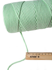 Green cotton cord Spool Beside Ruler