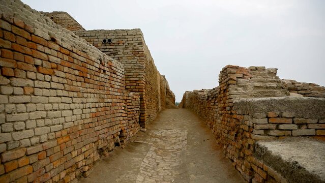 Ancient brick pathway amidst ruins Mohenjo Daro