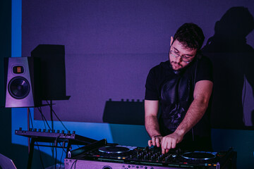 DJ mixing tracks at a vibrant nightclub scene
