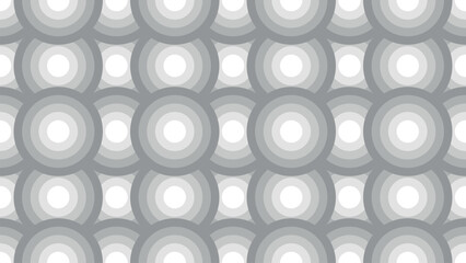 A pattern of circles in various sizes and shades of gray