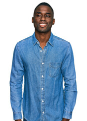 Young african american man wearing casual clothes with a happy and cool smile on face. lucky person.