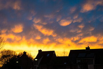 Colorful display of mammatus clouds at sunset after the passage of a thunderstorm