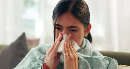 Woman, illness and tissue with blowing nose in home for respiratory infection, sick or cold. Female person, blanket and fever flu or virus suffering in living room with allergies, sneezing or fatigue - Powered by Adobe