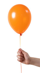 Hand holding Orange Rubber Balloon isolated on a white background. 