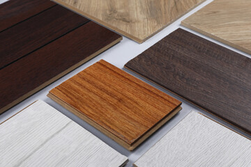 Different samples of wooden flooring on white background