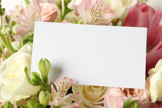 Happy Mother's Day. Beautiful flowers with blank card, closeup