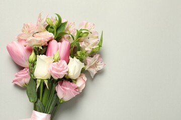 Happy Mother's Day. Bouquet of beautiful flowers on light grey background, top view. Space for text