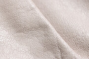 Beautiful beige leather as background, closeup view