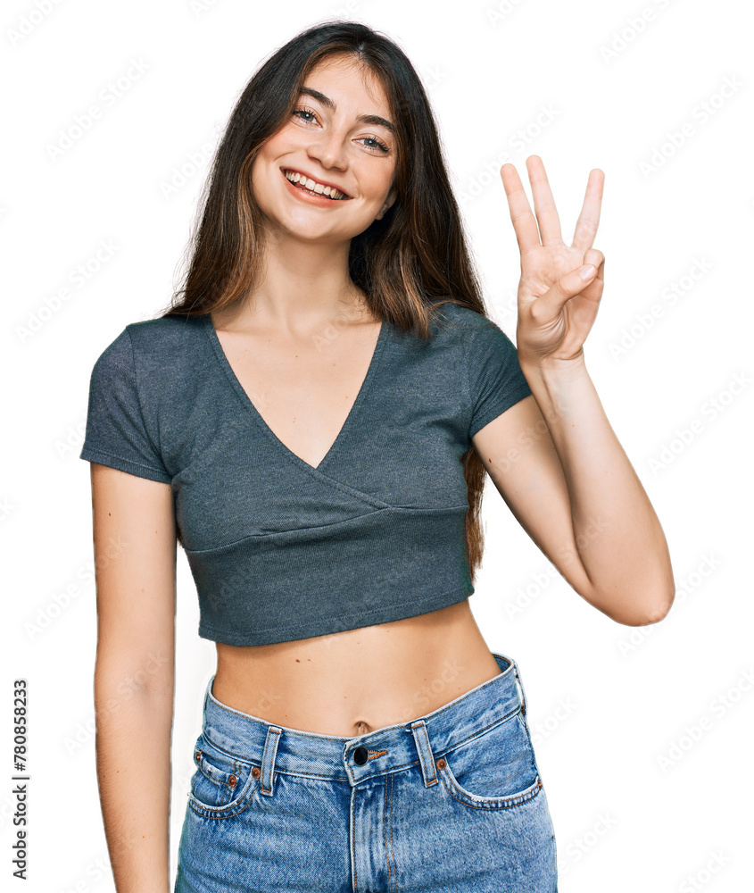 Canvas Prints Young beautiful teen girl wearing casual crop top t shirt showing and pointing up with fingers number three while smiling confident and happy.