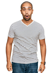 Fototapeta premium Hispanic adult man wearing casual clothes afraid and shocked with surprise expression, fear and excited face.