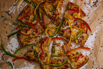 Delicious street pizza with some ingredients at side