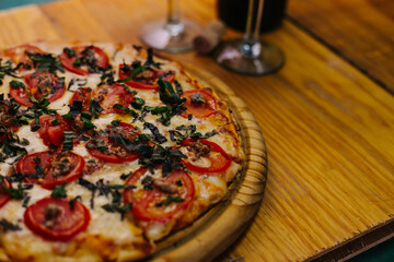 Tomato pizza with wine cups