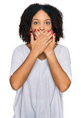 Young african american girl wearing casual clothes shocked covering mouth with hands for mistake....