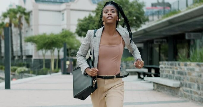 Business woman, running and late in city with briefcase for corporate job with speed on urban sidewalk. African employee, person and worker with bag, rush or schedule for fast commute on metro street