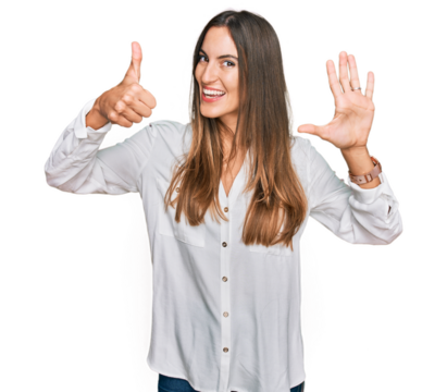 Young beautiful woman wearing casual clothes showing and pointing up with fingers number six while smiling confident and happy.