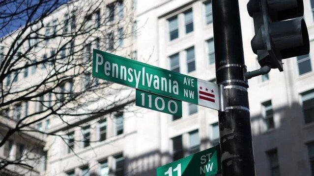 Pennsylvania Avenue, NW and 11th street NW street signs in downtown Washington DC area of lobbying and lawyers in nations capital