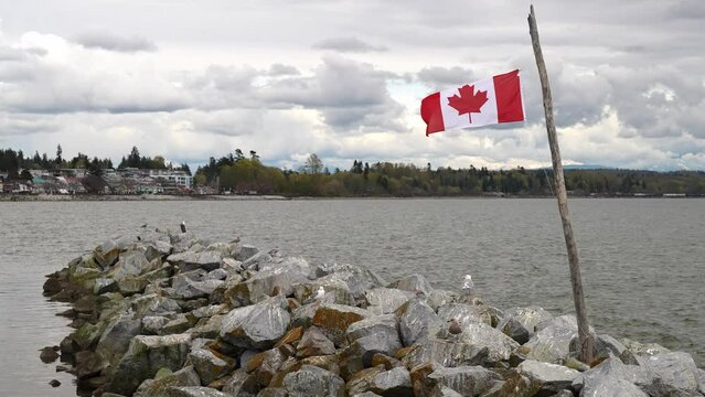 Canadian Flag Over White Rock Beach on April 7, 2024, BC, Canada