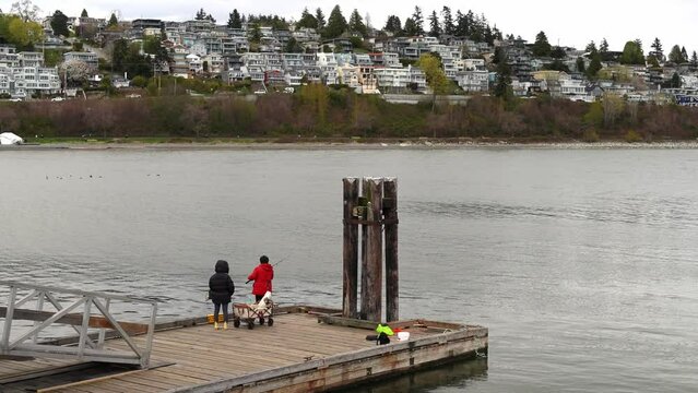 April 7, 2024: Locals on Pier at White Rock Beach, BC, Canada