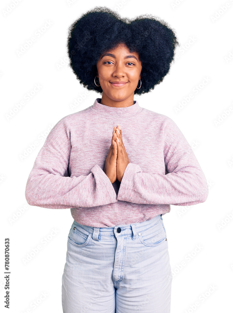 Canvas Prints Young african american girl wearing casual clothes praying with hands together asking for forgiveness smiling confident.