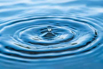 Naklejka na ściany i meble Close-up of blue water with calm ripples.