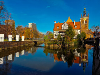 Gdansk, Poland  March 21, 2023: View of the Millers Guild house and the Radunia Canal in Gdansk. Poland - obrazy, fototapety, plakaty