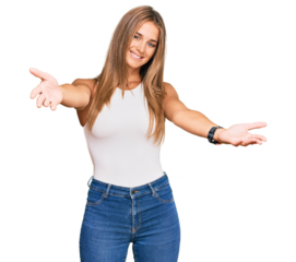 Young blonde woman wearing casual style with sleeveless shirt smiling cheerful offering hands giving assistance and acceptance.