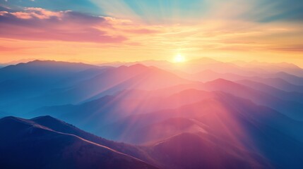Fototapeta premium Sunrise over mountains with rays piercing through mist and trees. Warm, tranquil landscape.