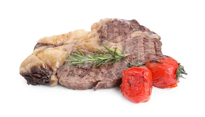 Schilderijen op glas Piece of delicious grilled beef meat, rosemary and tomatoes isolated on white © New Africa