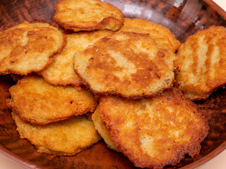Draniki in a plate, appetizing potato pancakes from above, fresh potato pancakes.
