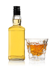 Glass and bottle of whiskey isolated on white