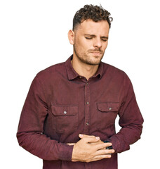 Young hispanic man wearing casual clothes with hand on stomach because indigestion, painful illness...