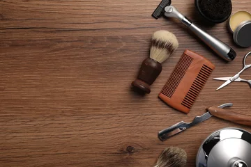 Fotobehang Moustache and beard styling tools on wooden background, flat lay. Space for text © New Africa
