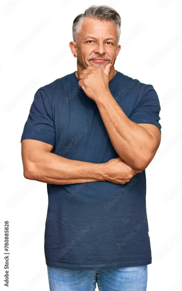 Poster middle age grey-haired man wearing casual clothes looking confident at the camera with smile with cr