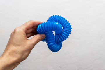 blue children's corrugated pipe toy. Pop Tubes, pipe accordion, antistress.