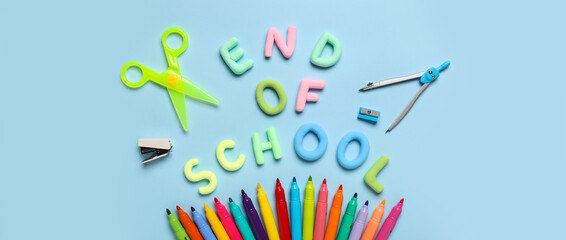 Text END OF SCHOOL, scissors and colorful felt-tip pens on blue background. Top view - obrazy, fototapety, plakaty