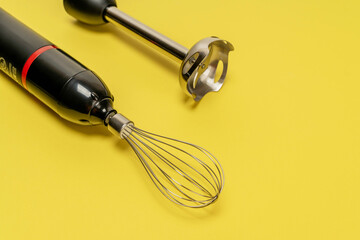 Whisk and Whisk Attachment on Yellow Background